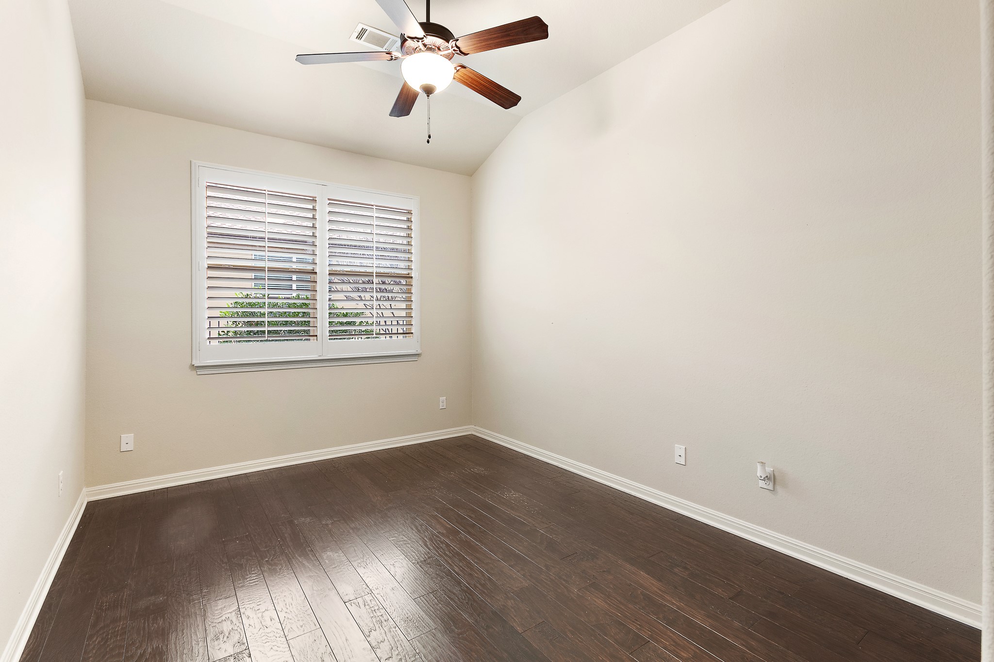 224 Tavish Trail Austin, TX 78738 - Photo 22 of 40 a view of a room with wooden floor and windows