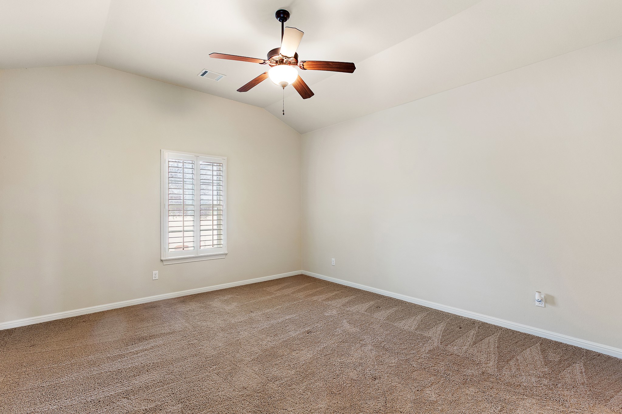 224 Tavish Trail Austin, TX 78738 - Photo 27 of 40 an empty room with a window and a fan