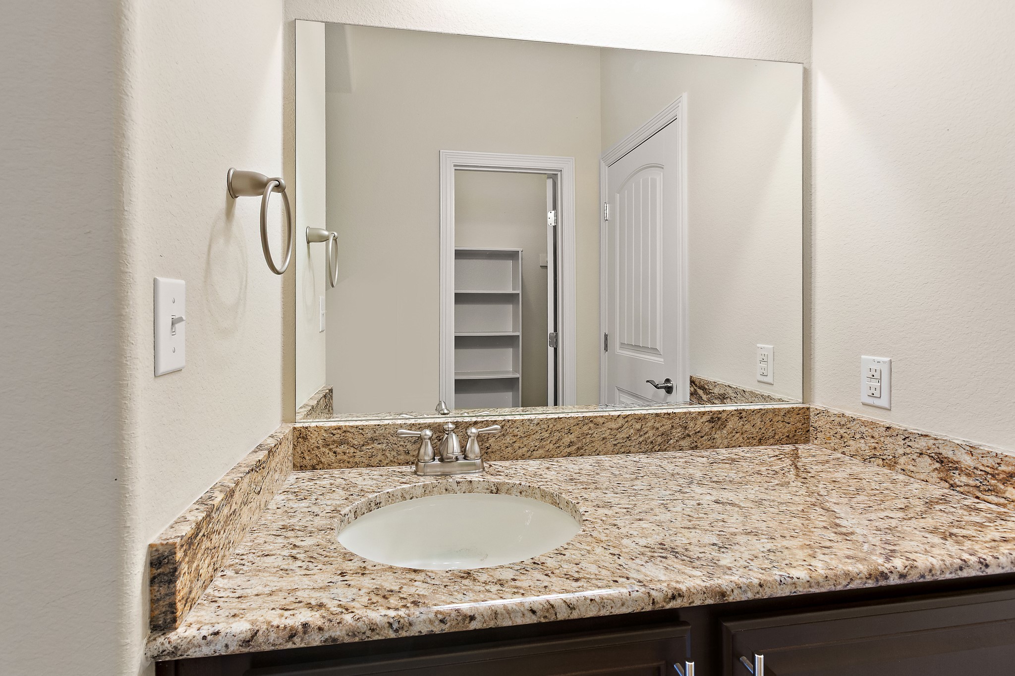 224 Tavish Trail Austin, TX 78738 - Photo 29 of 40 a bathroom with a granite countertop sink and a mirror
