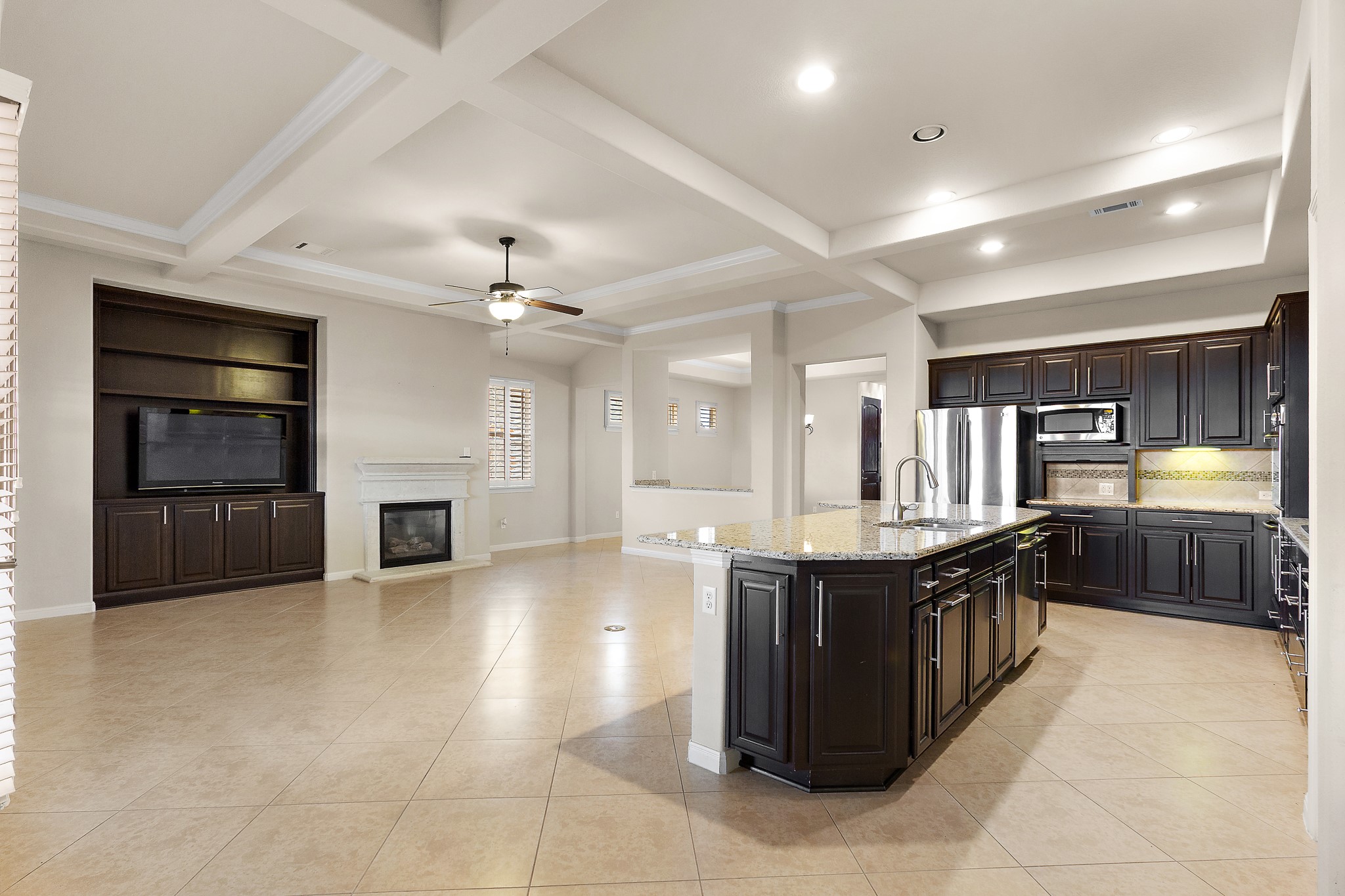 224 Tavish Trail Austin, TX 78738 - Photo 10 of 40 a large kitchen with stainless steel appliances granite countertop a stove and cabinets