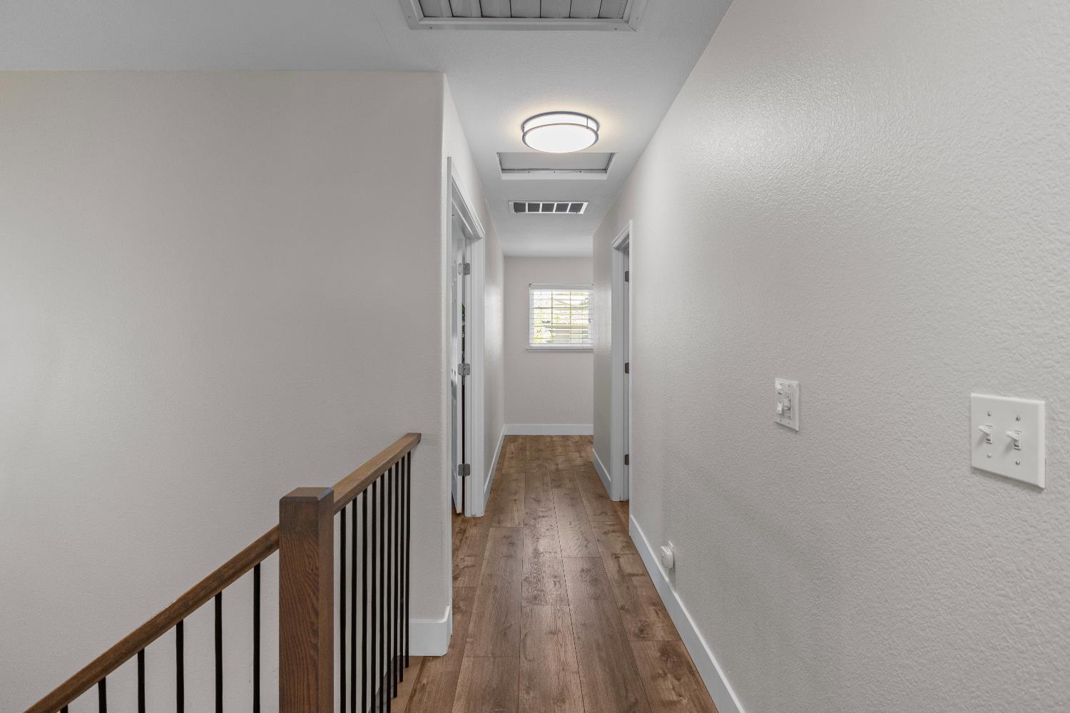 637 Rebekah Court Ripon, CA 95366 - Photo 44 of 69 a view of a hallway with wooden floor