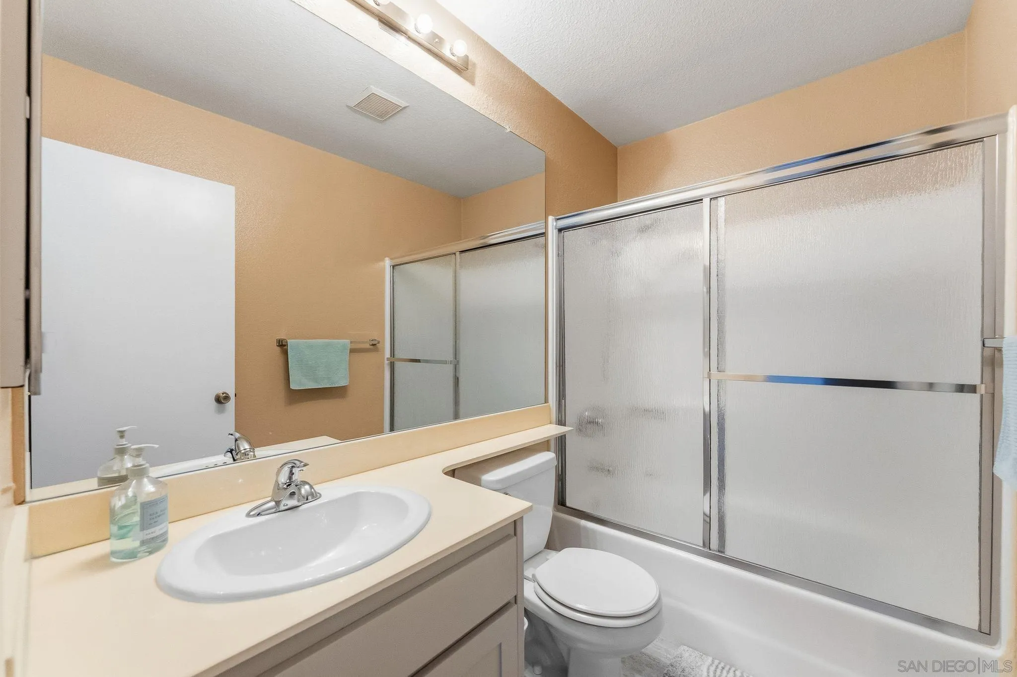 10565 Strathmore Drive Santee, CA 92071 - Photo 34 of 59 a bathroom with a sink toilet and shower
