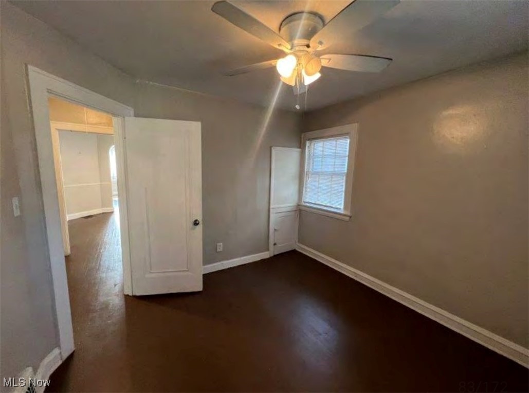 3579 Riedham Road Cleveland, OH 44120 - Photo 10 of 13 Unfurnished bedroom with dark wood-type flooring, a closet, and ceiling fan