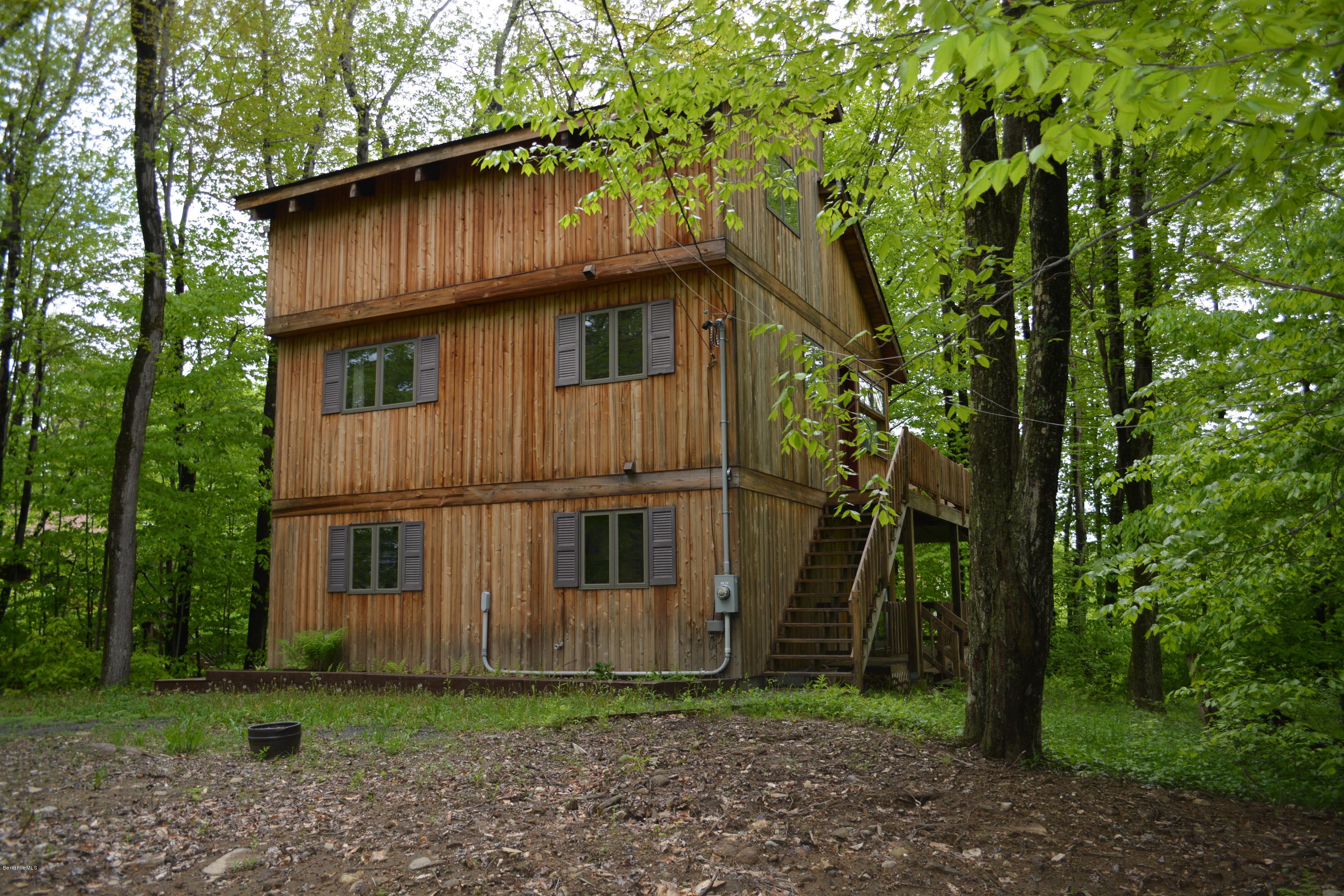 56 Slope Road Tolland, MA 01034 - Photo 1 of 52 a backyard of a house with lots of green space