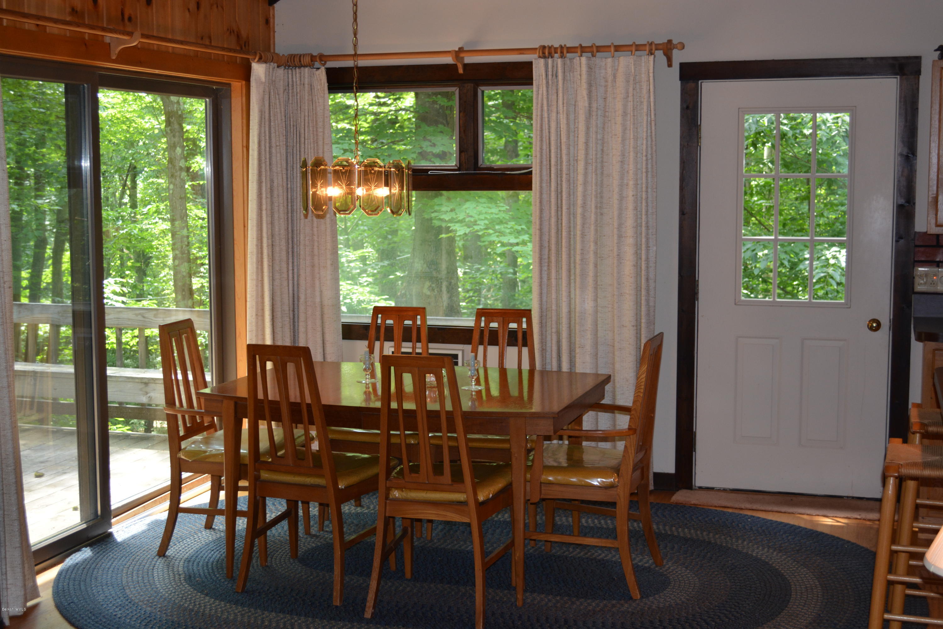 56 Slope Road Tolland, MA 01034 - Photo 11 of 52 a view of a dining room with furniture window and wooden floor