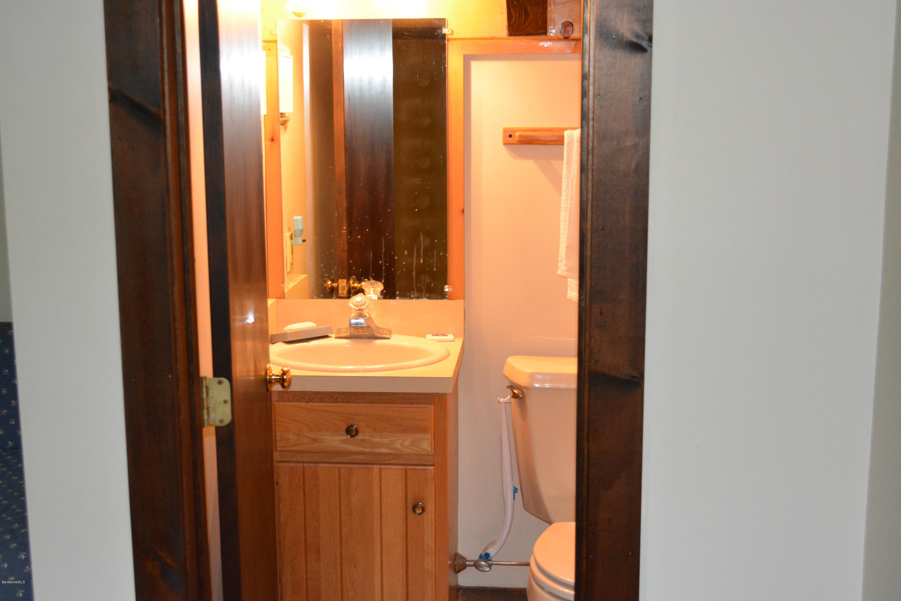 56 Slope Road Tolland, MA 01034 - Photo 20 of 52 a bathroom with a sink a toilet and shower