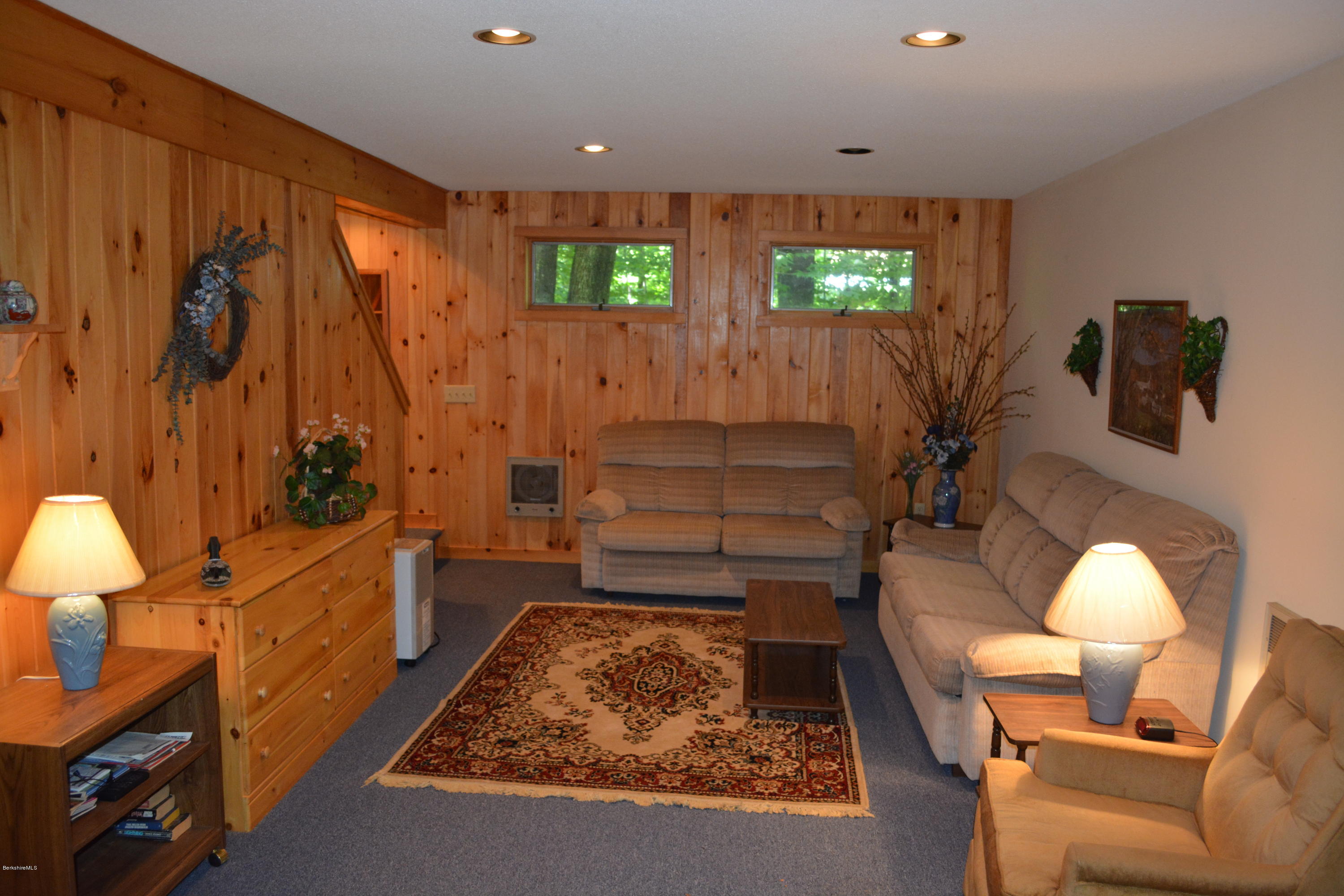 56 Slope Road Tolland, MA 01034 - Photo 3 of 52 a living room with furniture and a flat screen tv