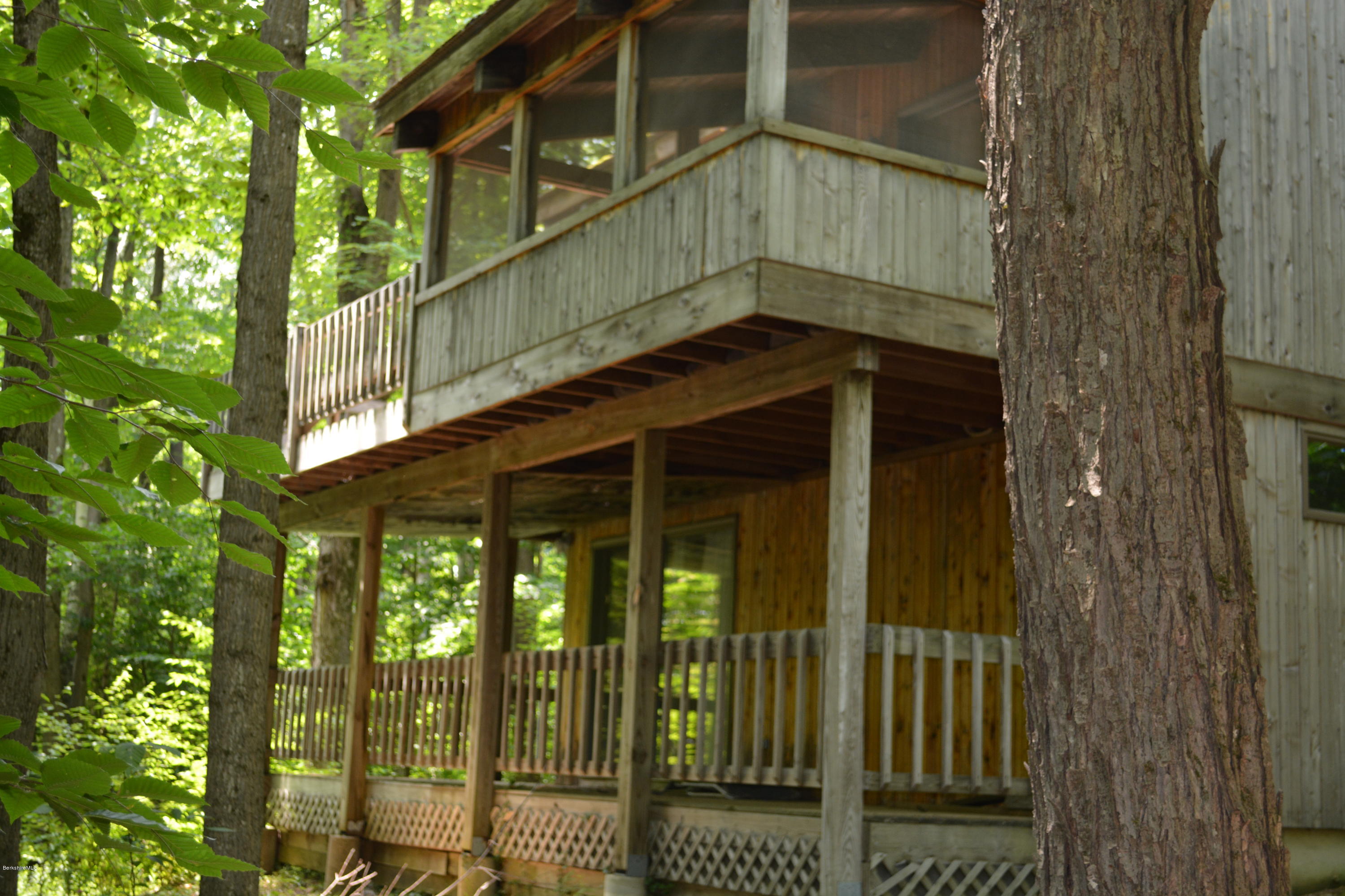 56 Slope Road Tolland, MA 01034 - Photo 22 of 52 a view of a house with a balcony