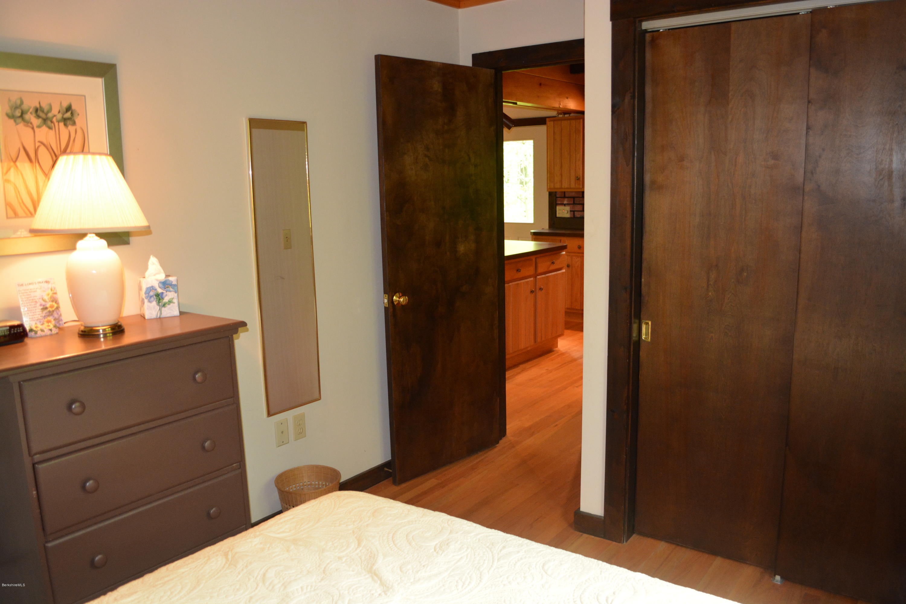56 Slope Road Tolland, MA 01034 - Photo 28 of 52 a bedroom with a bed and a mirror on dresser