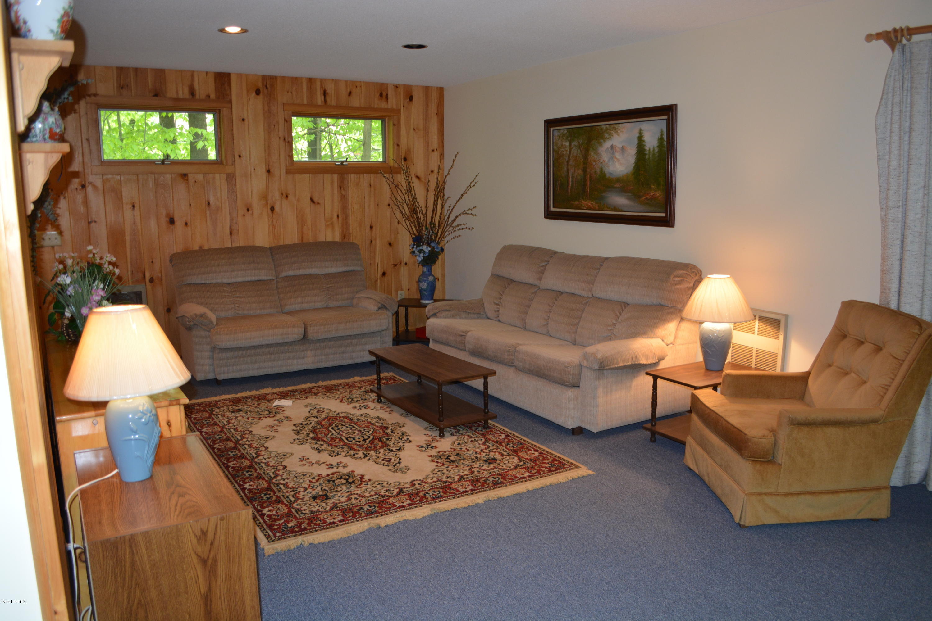 56 Slope Road Tolland, MA 01034 - Photo 4 of 52 a living room with furniture and a rug