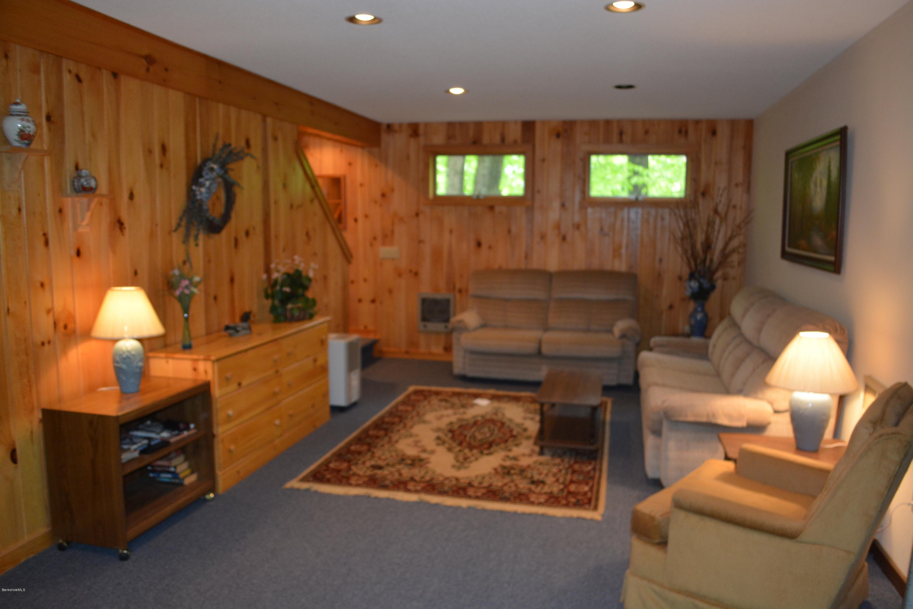 56 Slope Road Tolland, MA 01034 - Photo 31 of 52 a room with furniture and a fireplace