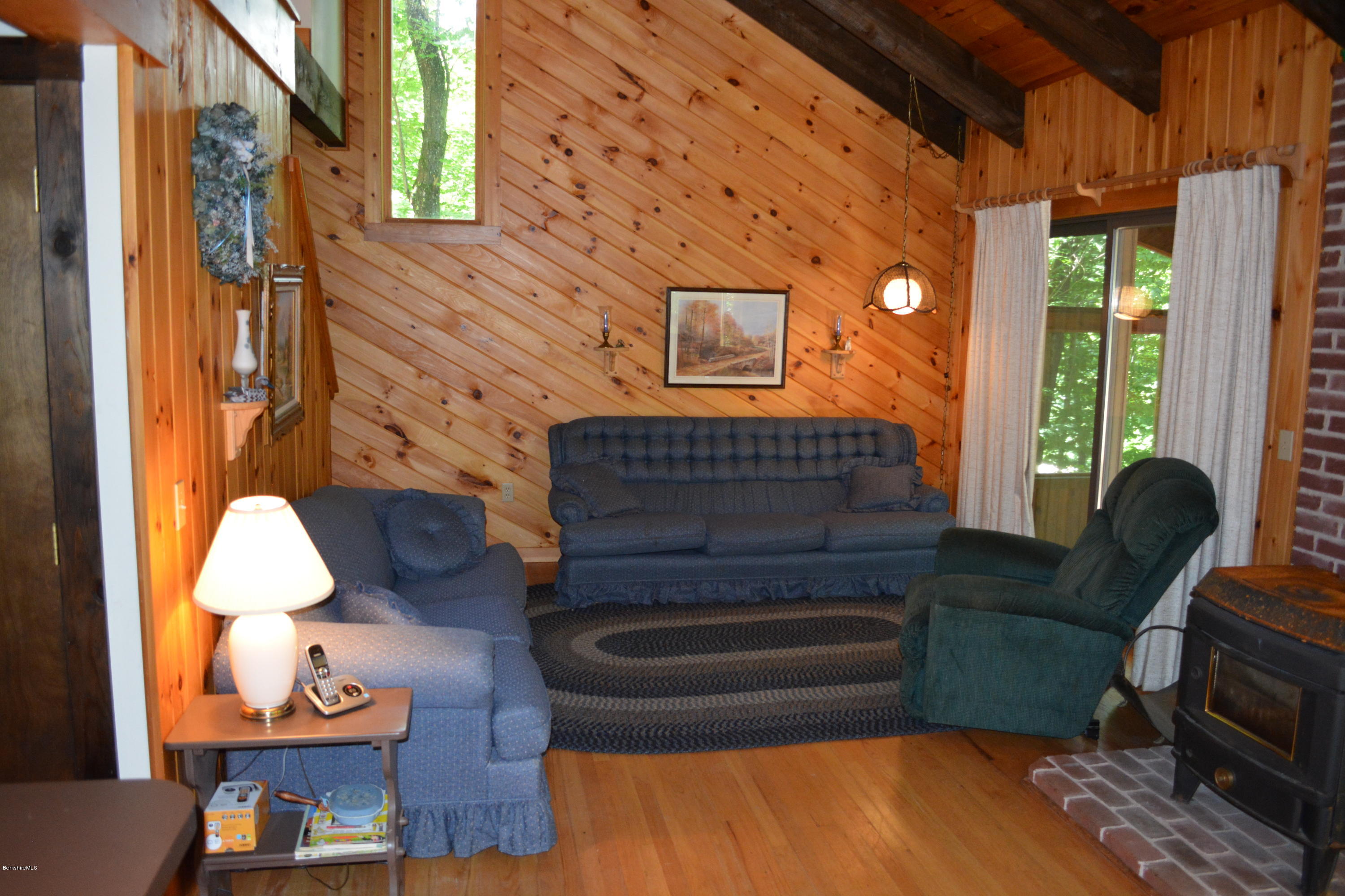 56 Slope Road Tolland, MA 01034 - Photo 33 of 52 a living room with furniture and a potted plant