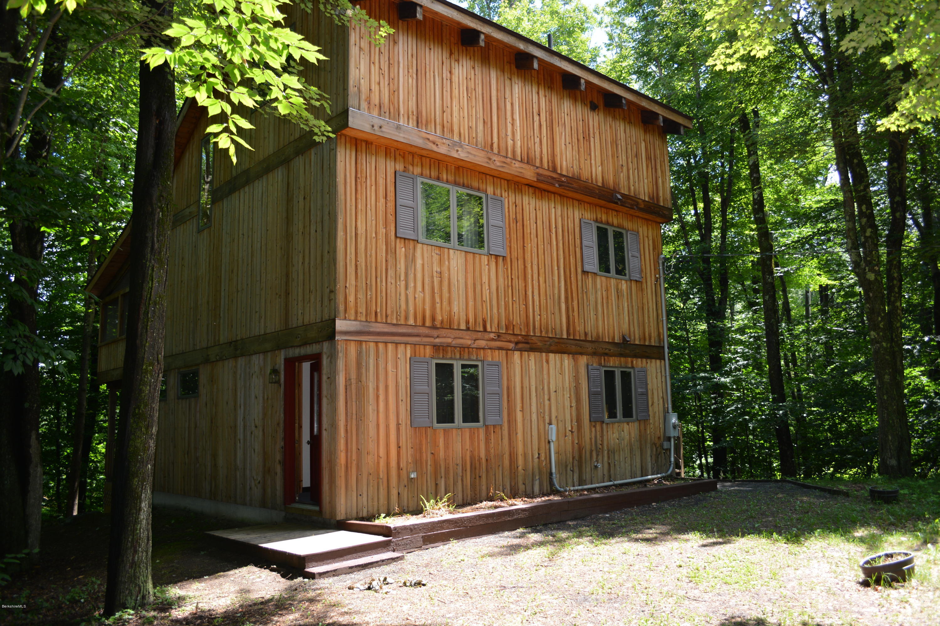 56 Slope Road Tolland, MA 01034 - Photo 38 of 52 a view of a house with a yard