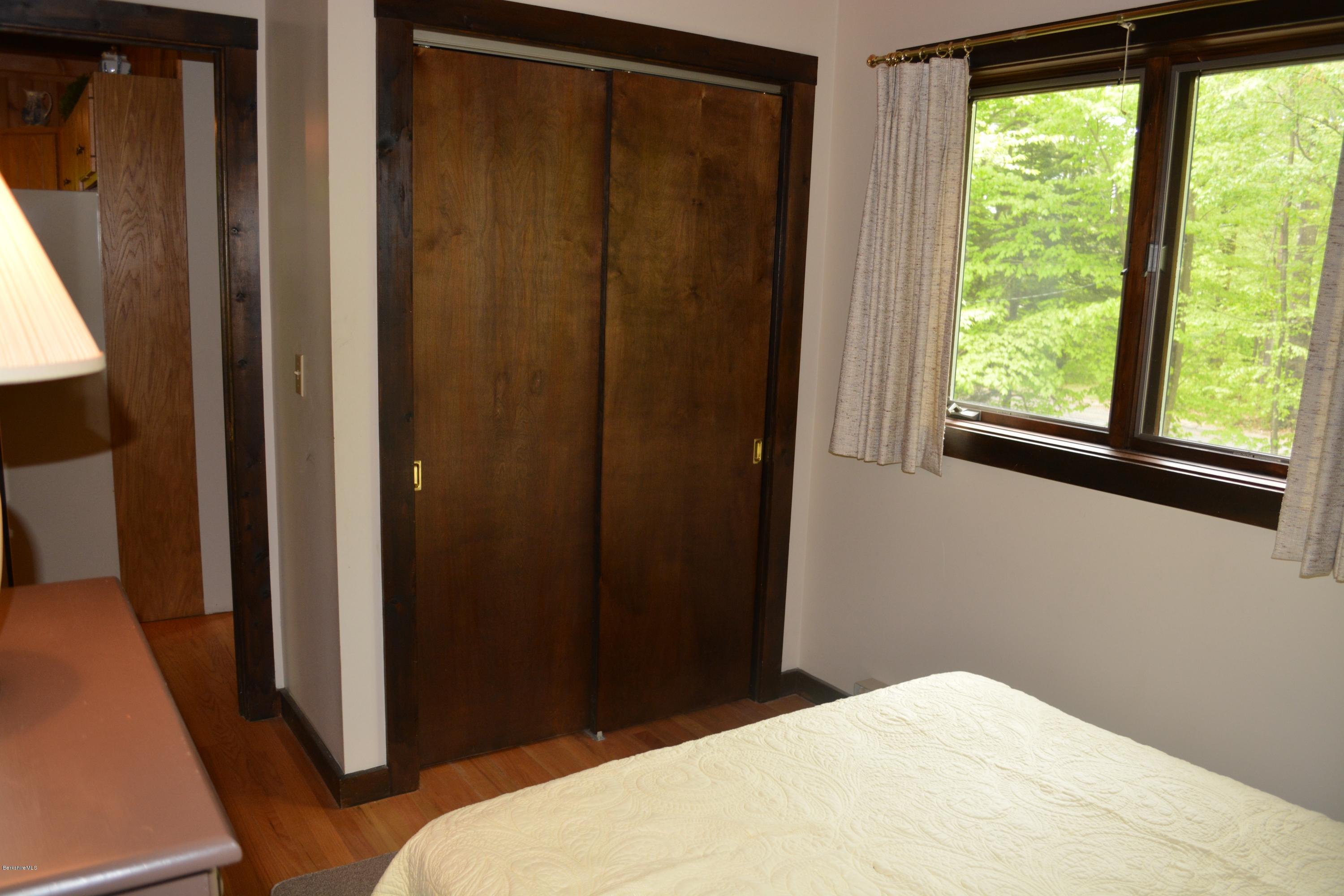 56 Slope Road Tolland, MA 01034 - Photo 42 of 52 a bedroom with a bed and a window