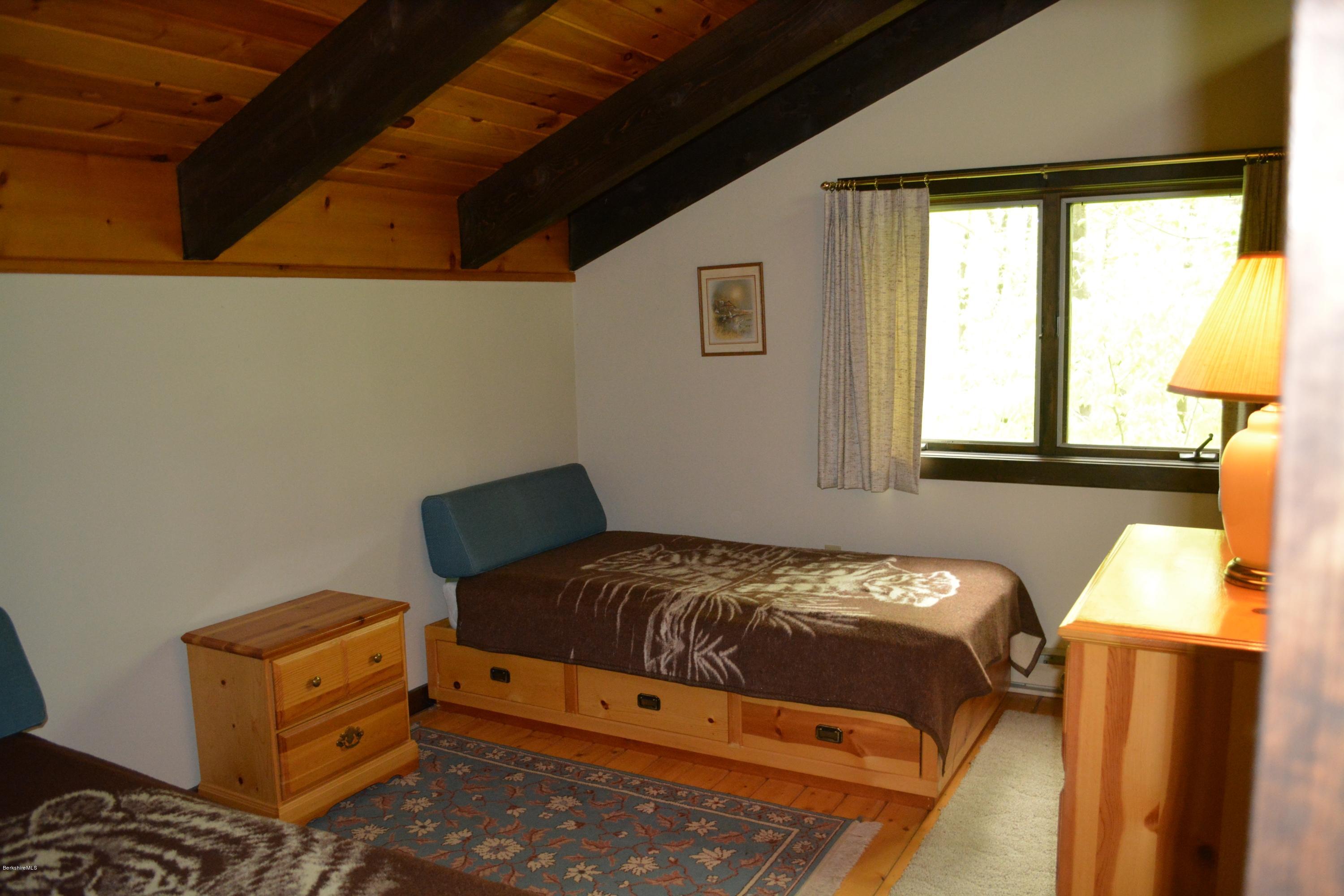56 Slope Road Tolland, MA 01034 - Photo 44 of 52 a bedroom with a bed and a window