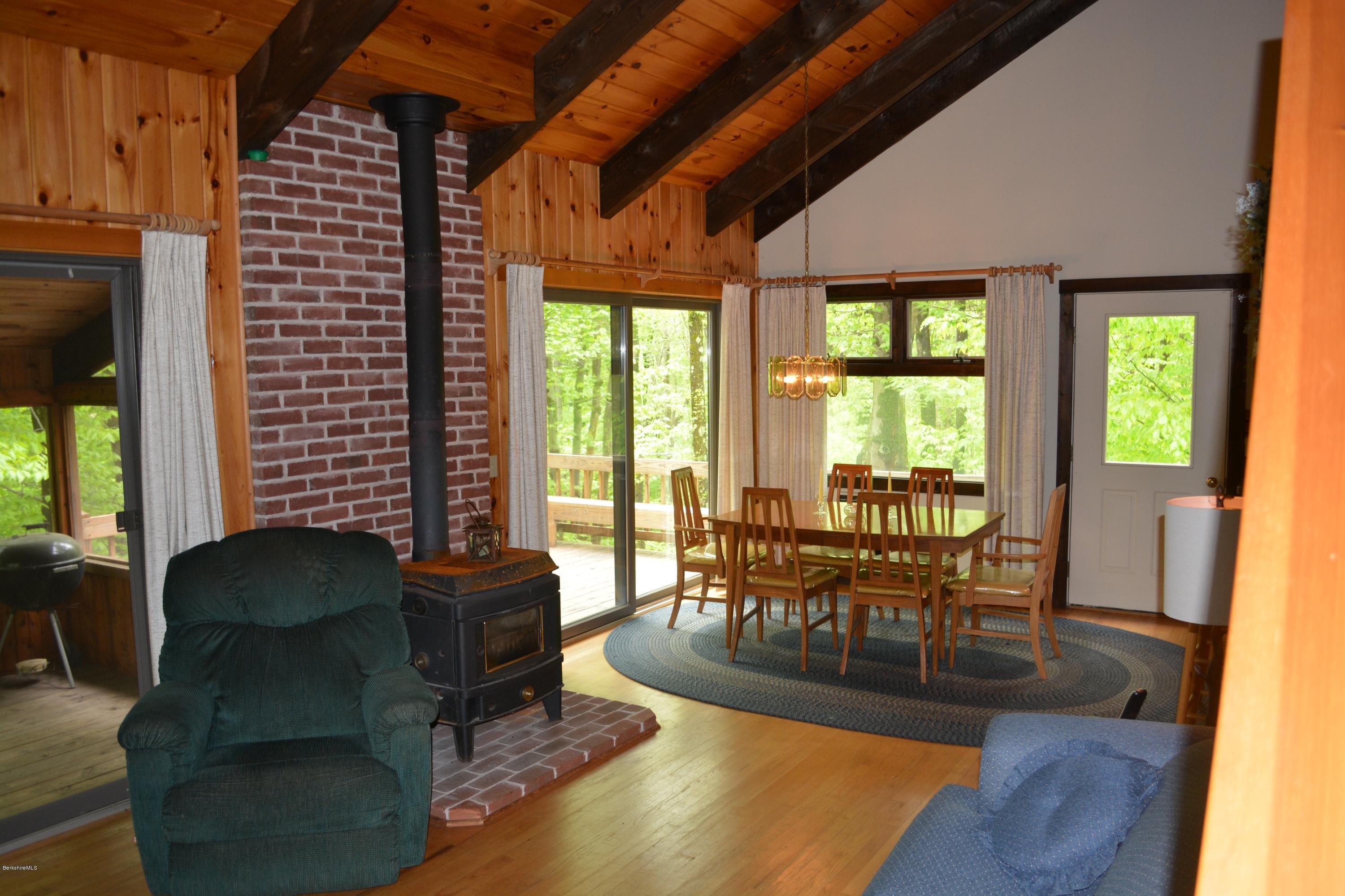 56 Slope Road Tolland, MA 01034 - Photo 46 of 52 a dining room with furniture and wooden floor