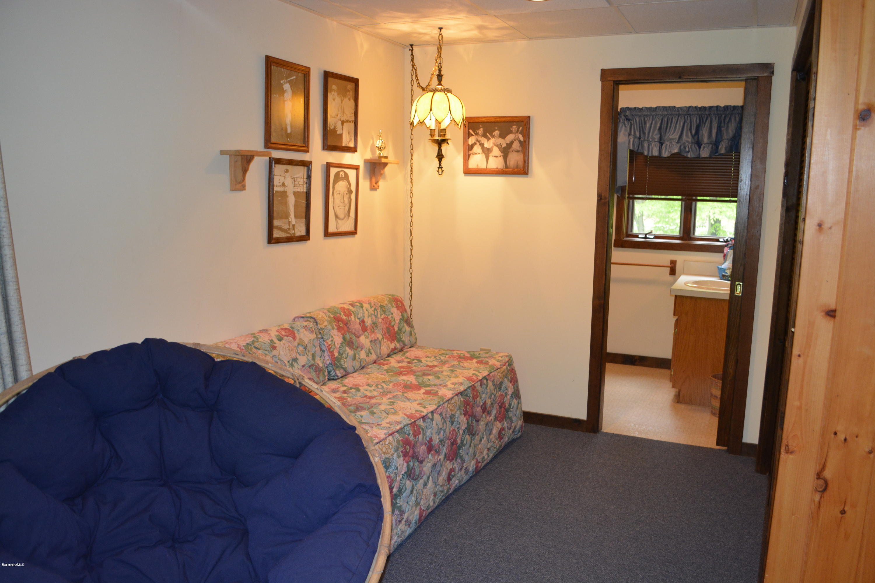 56 Slope Road Tolland, MA 01034 - Photo 7 of 52 a bedroom with a bed and a walk in closet