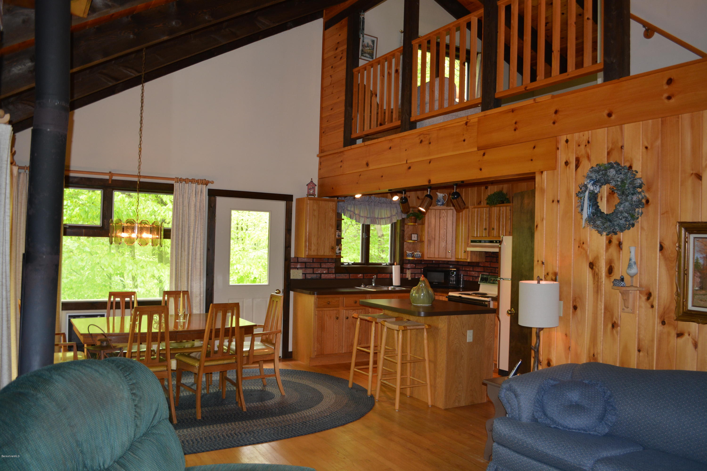 56 Slope Road Tolland, MA 01034 - Photo 10 of 52 a living room with fireplace furniture and a large window