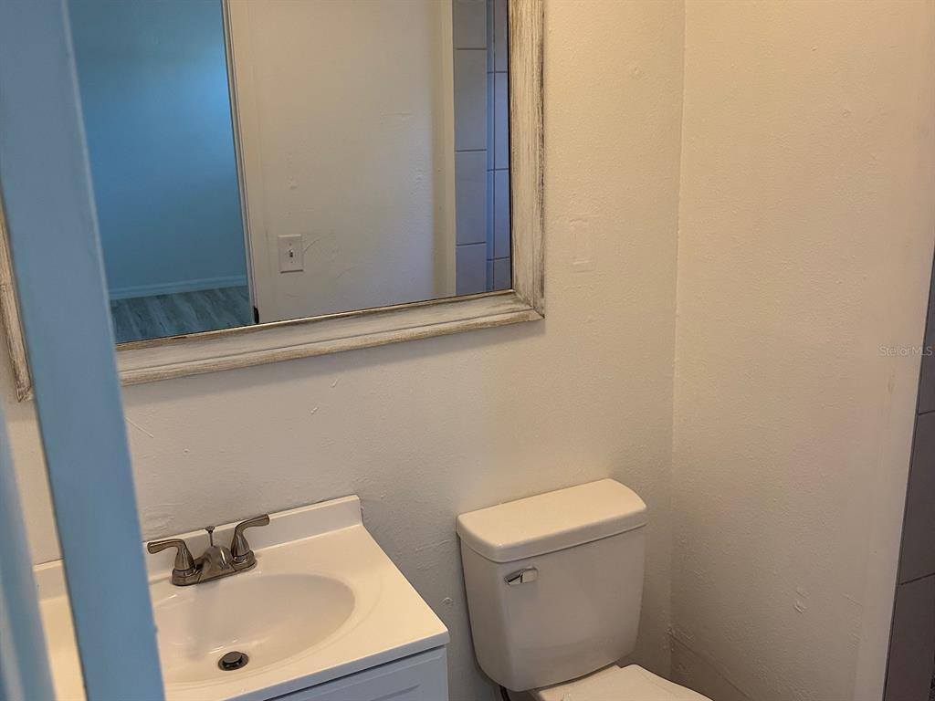 623 Beckett Way, Unit A Tarpon Springs, FL 34689 - Photo 11 of 19 a bathroom with a sink and a toilet