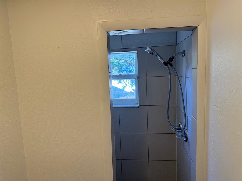 623 Beckett Way, Unit A Tarpon Springs, FL 34689 - Photo 14 of 19 a bathroom with a bathtub