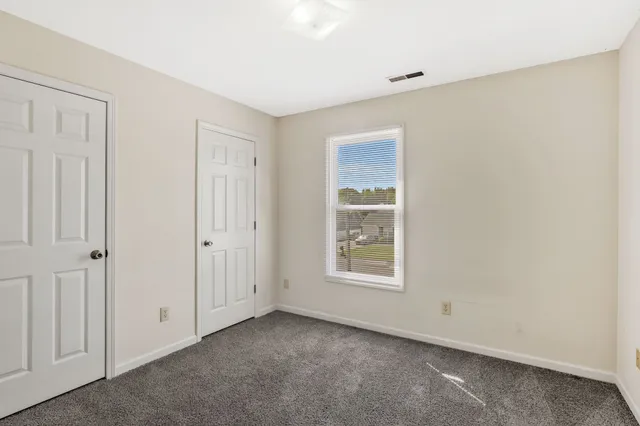 an empty room with windows