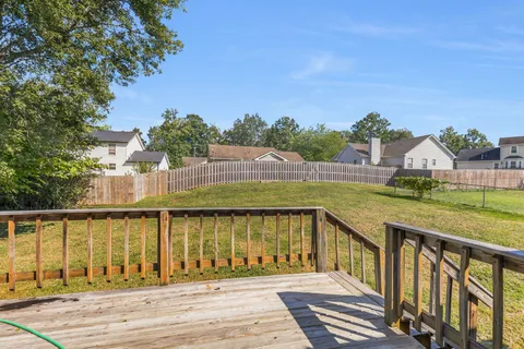 a view of swimming pool with outdoor seating and deck