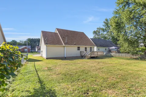 a house with trees in the background