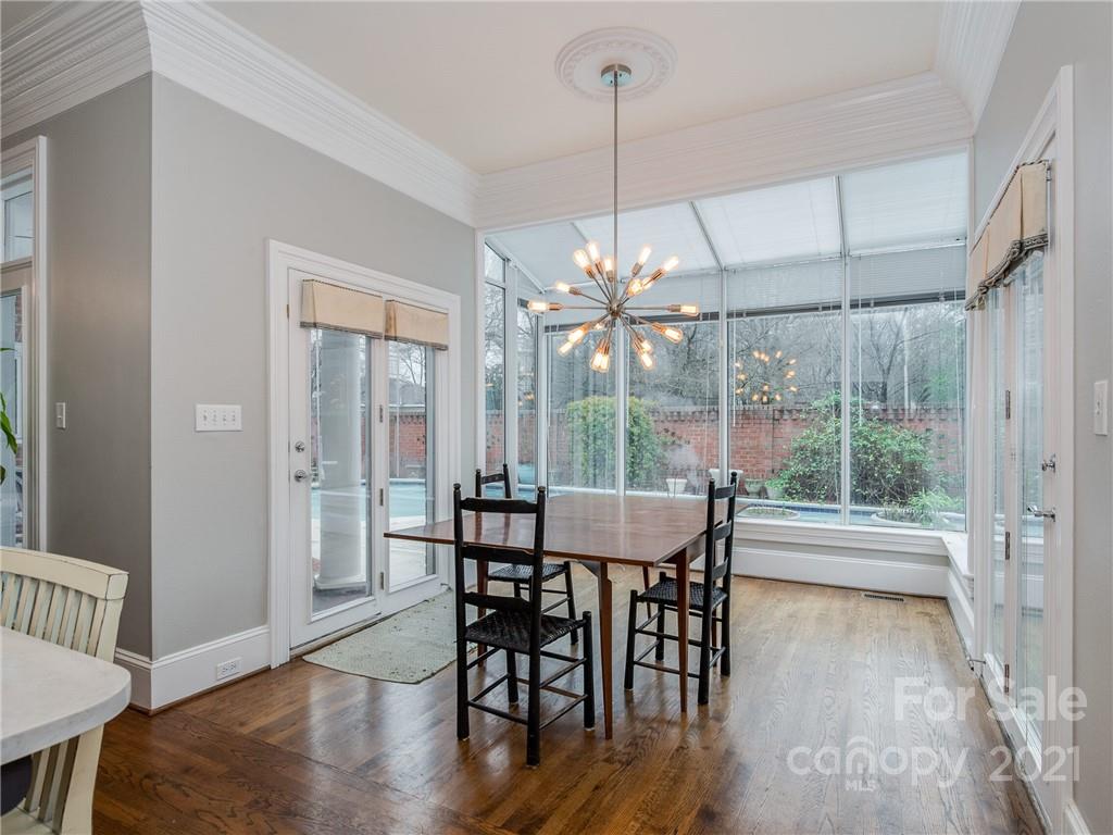 2131 Rolston Drive Charlotte, NC 28207 - Photo 13 of 35 a view of a dining room with furniture wooden floor and chandelier