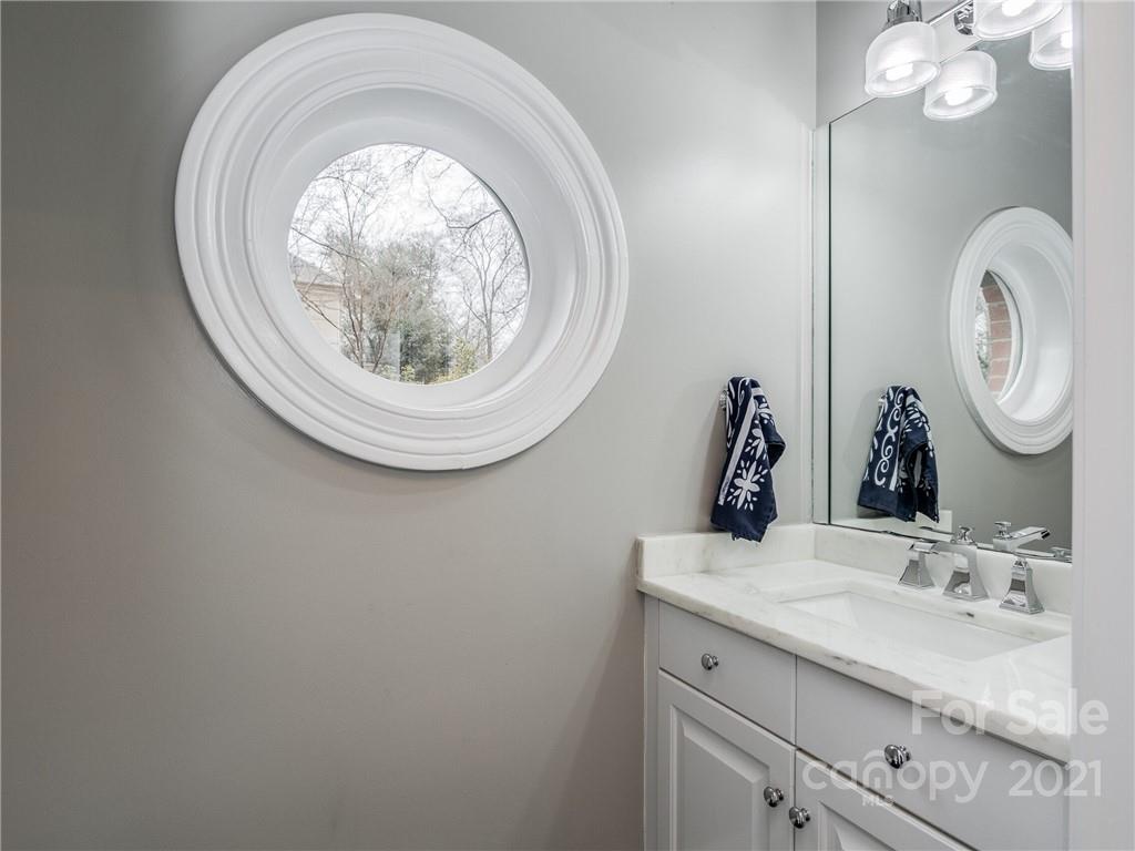 2131 Rolston Drive Charlotte, NC 28207 - Photo 15 of 35 a bathroom with a sink and a mirror