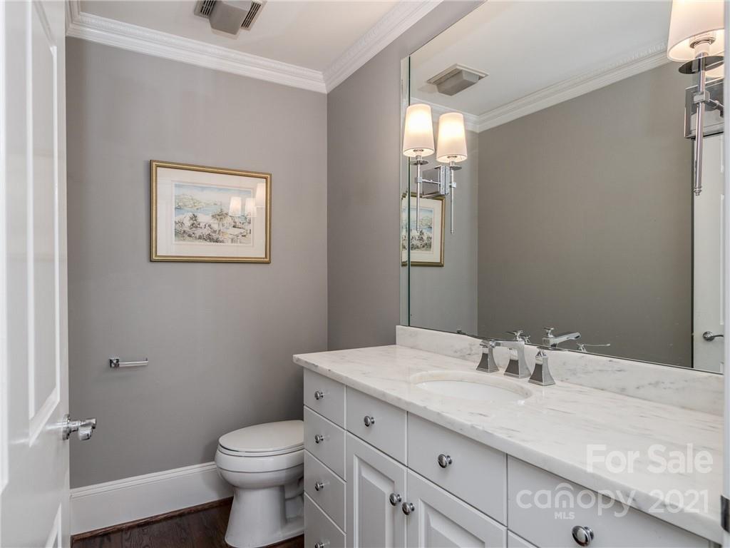2131 Rolston Drive Charlotte, NC 28207 - Photo 17 of 35 a bathroom with a granite countertop sink mirror and toilet