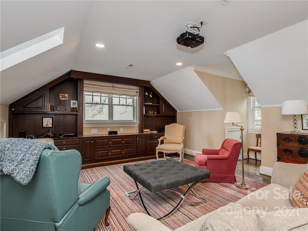 2131 Rolston Drive Charlotte, NC 28207 - Photo 19 of 35 a living room with furniture and a large window