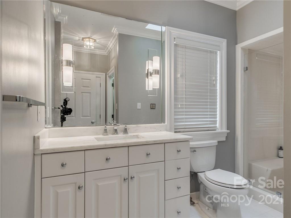 2131 Rolston Drive Charlotte, NC 28207 - Photo 26 of 35 a bathroom with a toilet sink and mirror