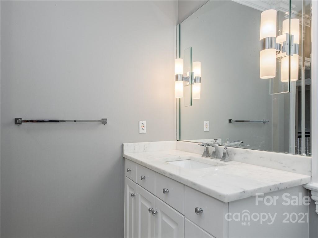 2131 Rolston Drive Charlotte, NC 28207 - Photo 27 of 35 a bathroom with a sink and a mirror