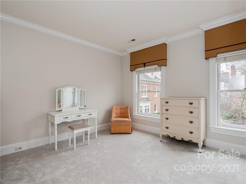 2131 Rolston Drive Charlotte, NC 28207 - Photo 30 of 35 a bedroom with furniture and a window
