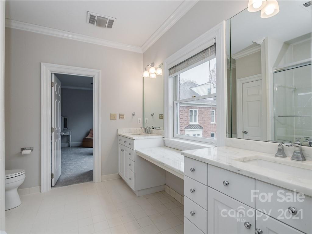 2131 Rolston Drive Charlotte, NC 28207 - Photo 31 of 35 a spacious bathroom with a granite countertop sink mirror and toilet