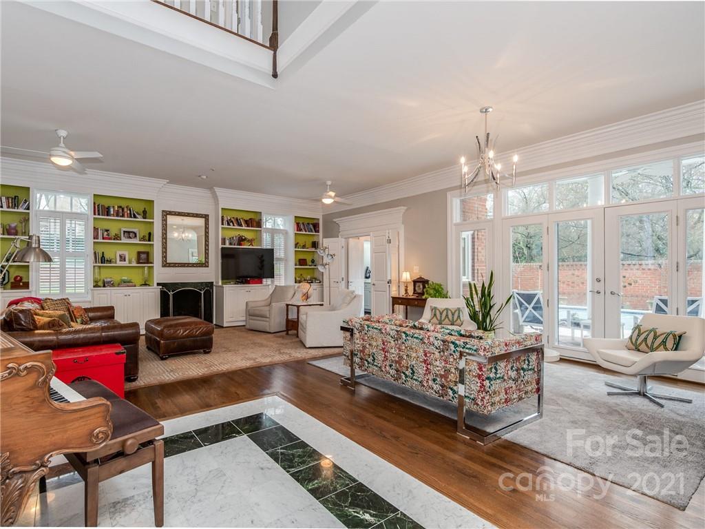 2131 Rolston Drive Charlotte, NC 28207 - Photo 8 of 35 a living room with furniture and a floor to ceiling window
