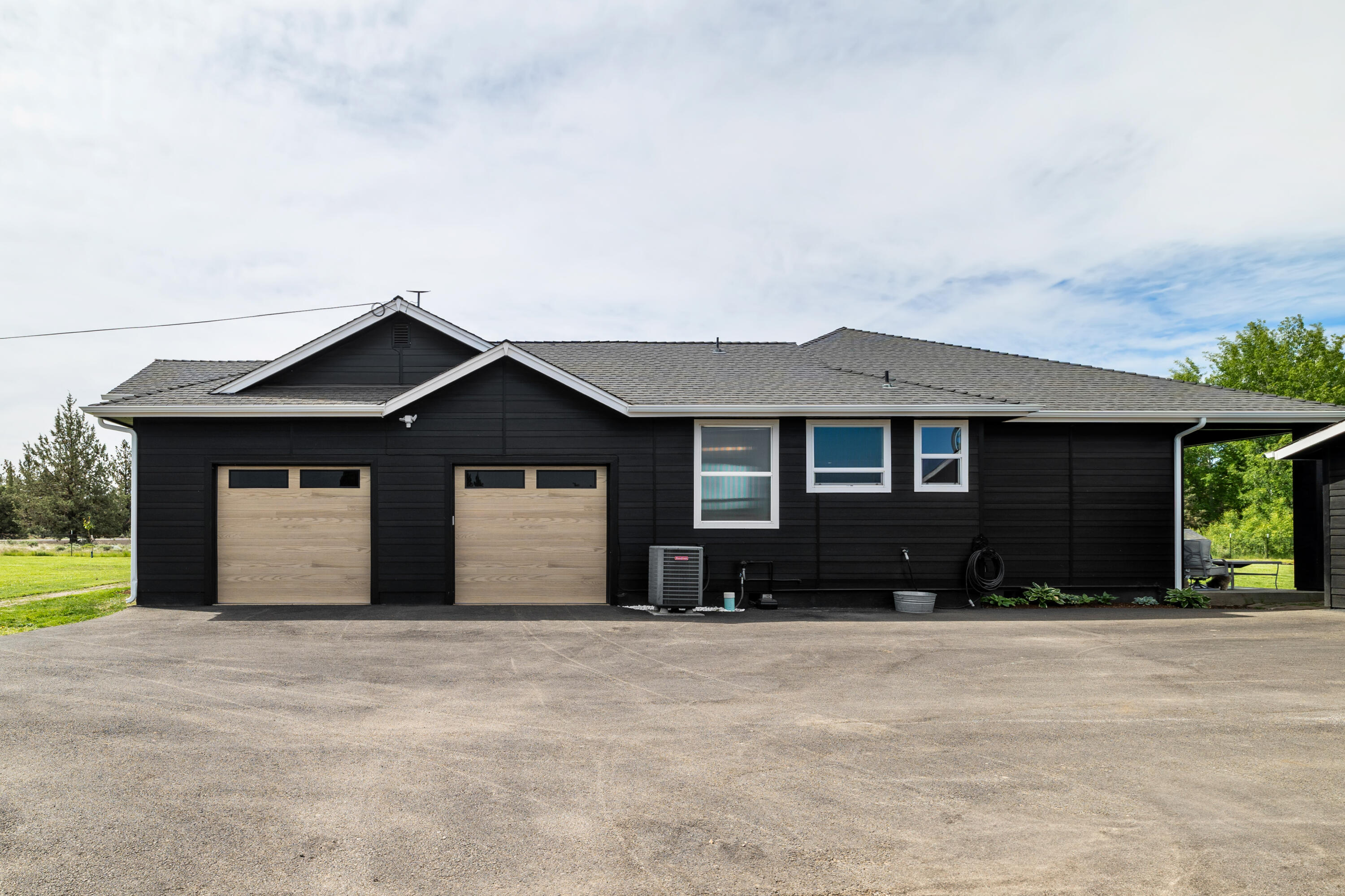 62705 Hamby Road Bend, OR 97701 - Photo 42 of 49 a front view of a house with a yard