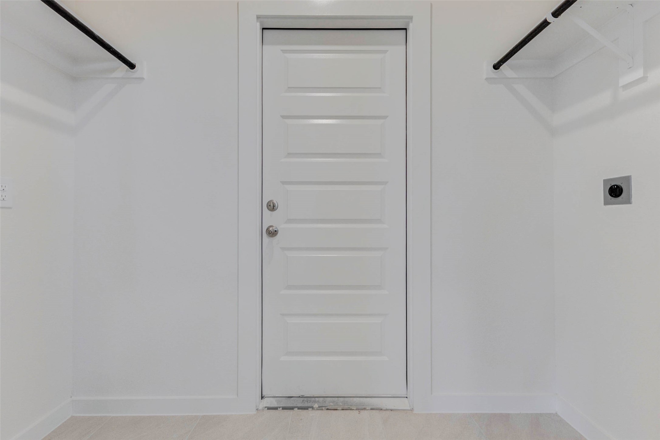 1131 Santee Court Rosharon, TX 77583 - Photo 16 of 31 Conveniently located just off the garage, this utility room is ready for your washer and dryer. Built-in hanging space and upper shelves maximize storage, while the exterior-style door leads straight into the main living areas.