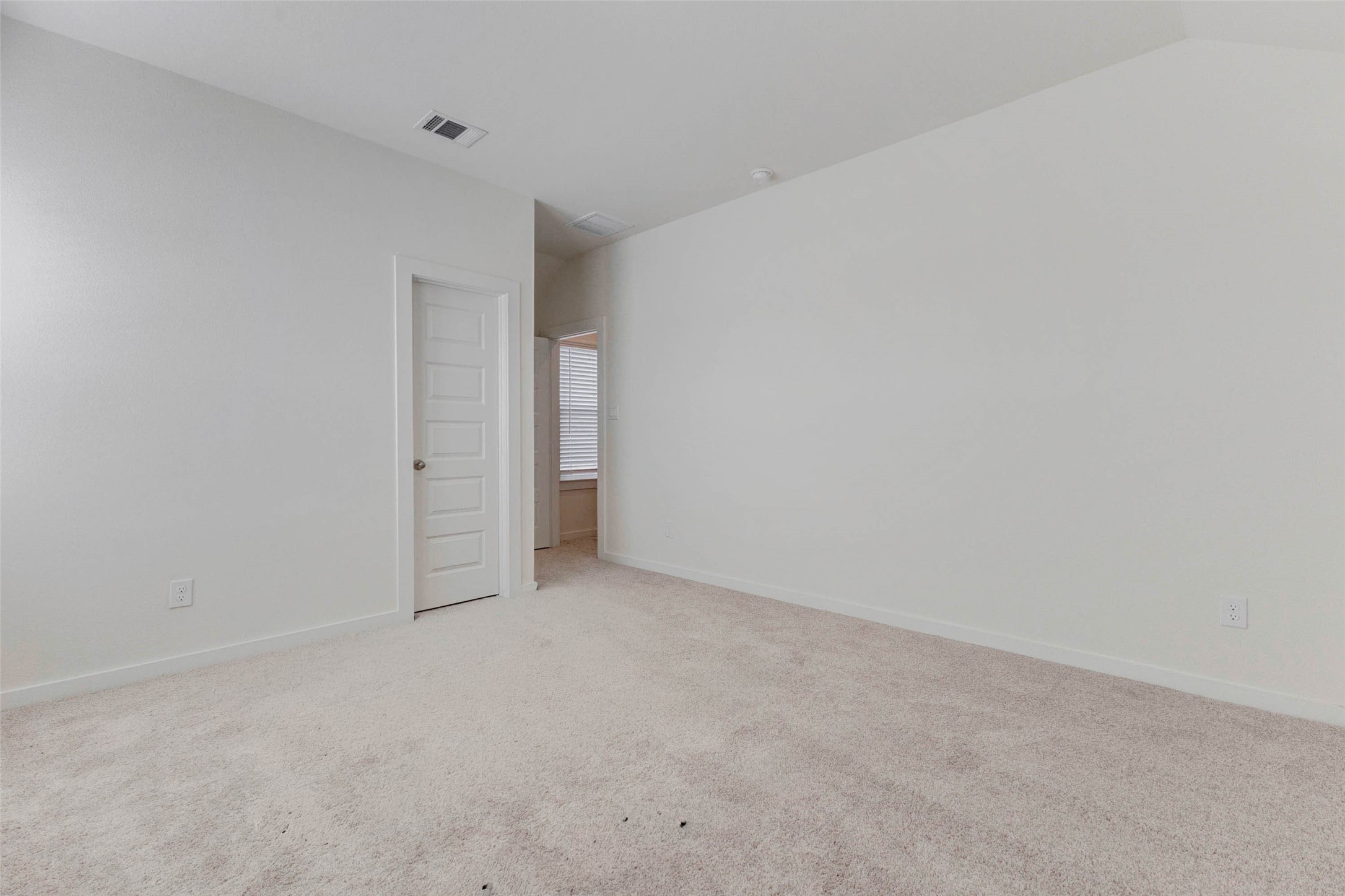 1131 Santee Court Rosharon, TX 77583 - Photo 18 of 31 One of the two well-sized secondary bedrooms, this space features soft carpet, clean walls, and a private entry to the hallway and shared bathroom. A great guest suite or personalized retreat for family members.