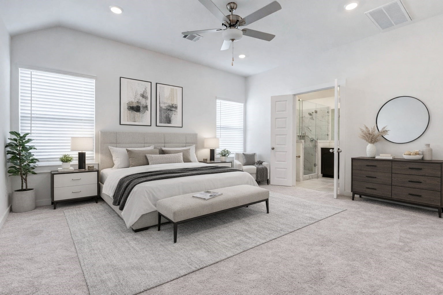 1131 Santee Court Rosharon, TX 77583 - Photo 4 of 31 The spacious primary suite delivers comfort and calm with plush carpeting, a ceiling fan, and ample natural light from dual windows. A private en-suite bath with dual sinks and a glass shower awaits just beyond the double doors. This photo has been virtually staged for visual reference.