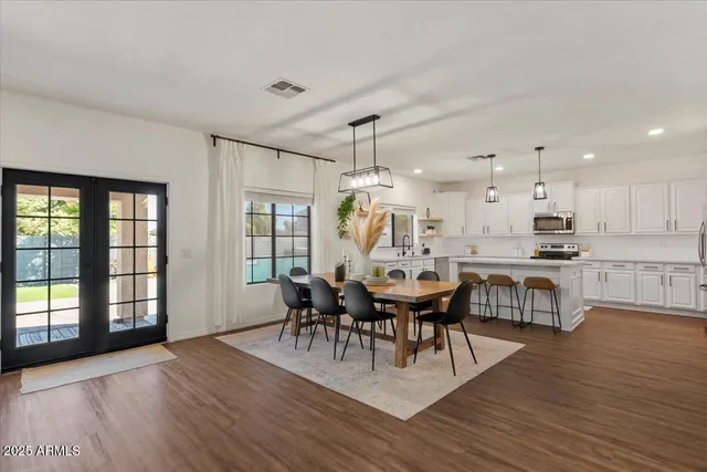 a view of a dining room with furniture window and wooden floor