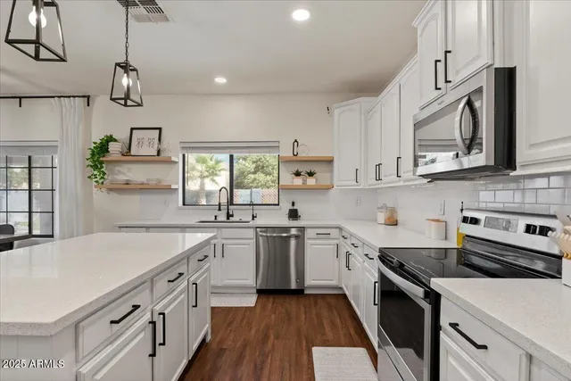 a room with furniture a rug and a book shelf
