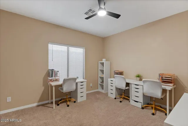 a spacious bedroom with a large bed and a flat screen tv