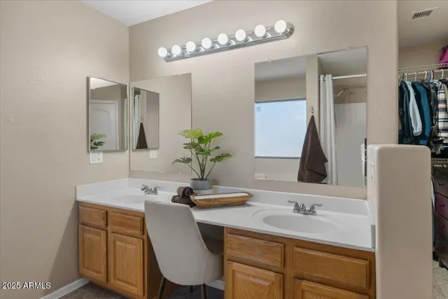 a bedroom with a large bed and a flat screen tv