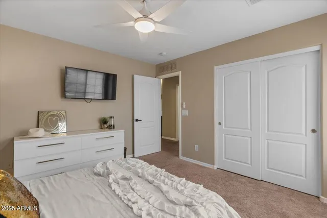 a bedroom with two beds and a window