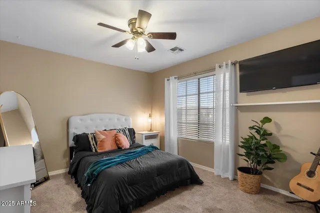 a view of a patio with couches and potted plants