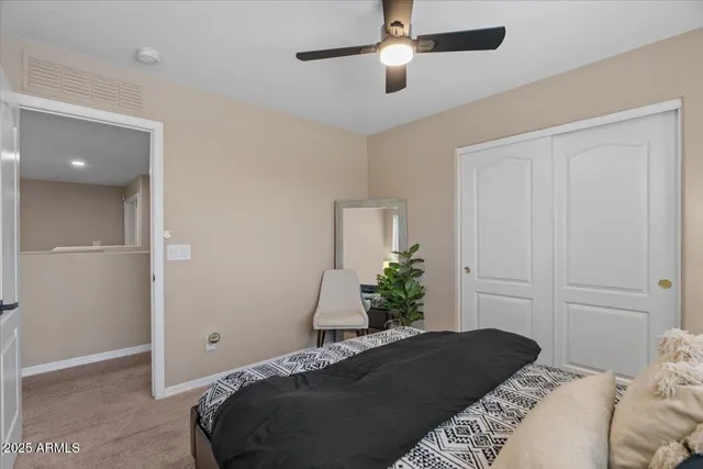 a view of a patio with table and chairs under an umbrella