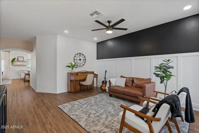 a living room with furniture rug and window
