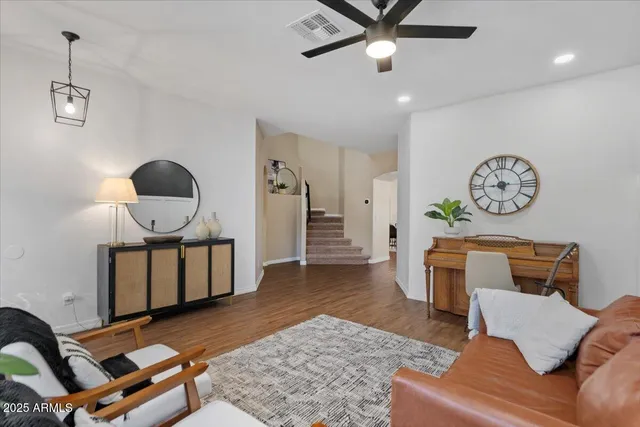 a living room with furniture and a large window