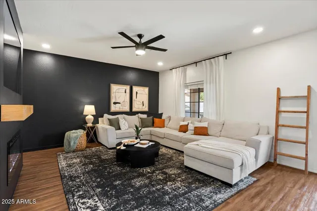 a living room with furniture and a large window